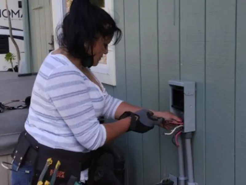 Licensed electrician wiring an exterior subpanel in Bon Air